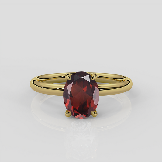Daisy garnet solitaire engagement ring with floral gallery/floral basket. 18ct yellow gold nature inspired design with oval garnet centre stone by London jewellery designer, Georgina Yvonne