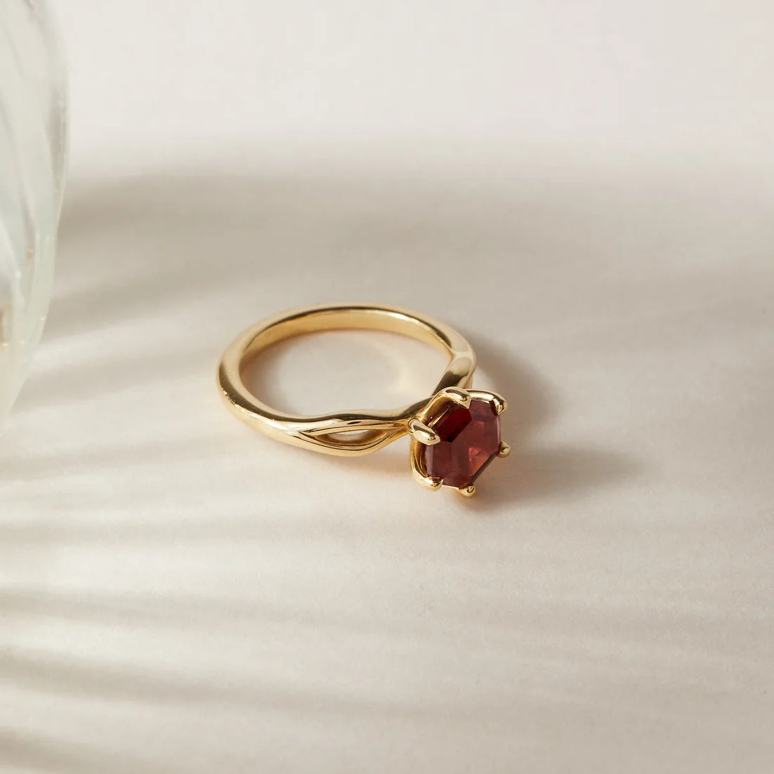 18ct yellow gold Ivy hexagon garnet engagement ring by London jewellery designer, Georgina Yvonne. Twist band design