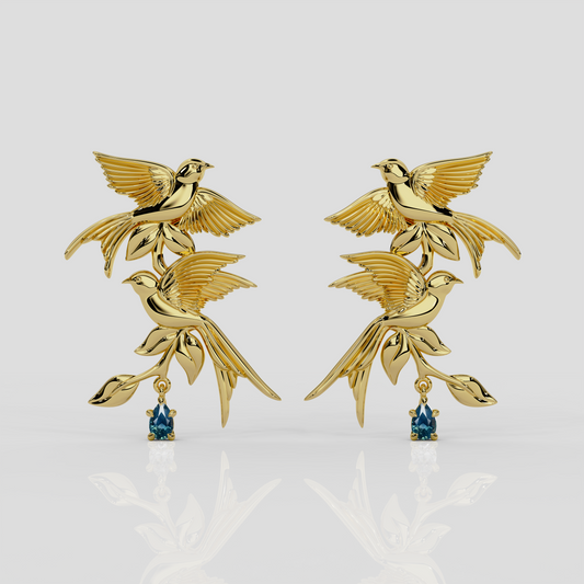 18ct yellow gold and teal sapphire Bird Song Earrings by London jewellery designer, Georgina Yvonne, from the award winning Wonderland jewellery collection.