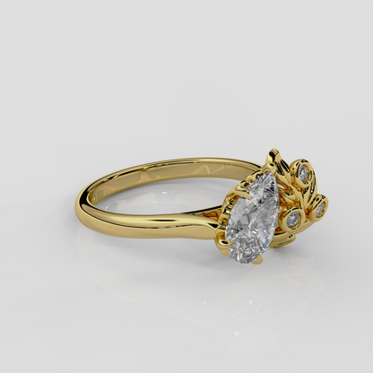18ct yellow gold and diamond Berry engagement ring by London jewellery designer, Georgina Yvonne. Pear diamond centre, either lab grown or natural diamond, with nature inspired design