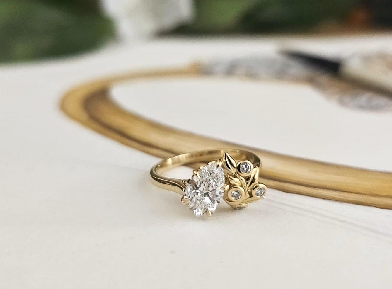 Diamond 18ct yellow gold Berry engagement ring by London jewellery designer, Georgina Yvonne. Nature inspired design with pear diamond centre