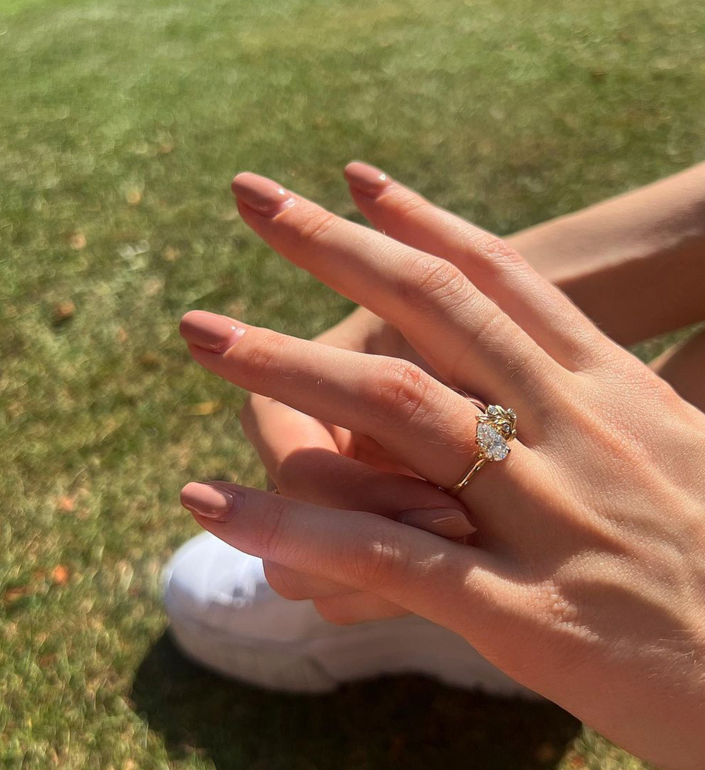 The Berry engagement ring design by London jewellery designer, Georgina Yvonne. 18ct yellow gold with pear lab grown diamond centre stone, and lab grown diamond accent stones.