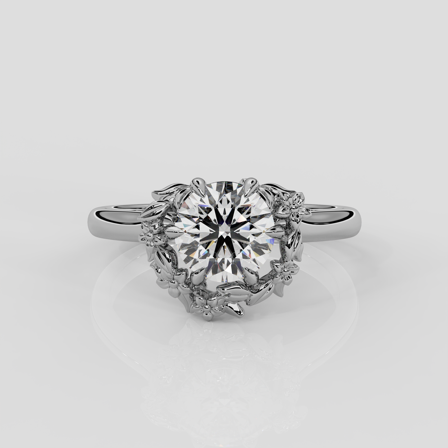 Platinum Blossom Engagement Ring by London jewellery designer, Georgina Yvonne. Nature inspired design with round brilliant cut diamond centre 