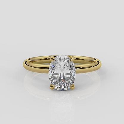 18ct yellow gold Daisy solitaire engagement ring by London jewellery designer, Georgina Yvonne. Nature inspired design with floral gallery and oval diamond centre 