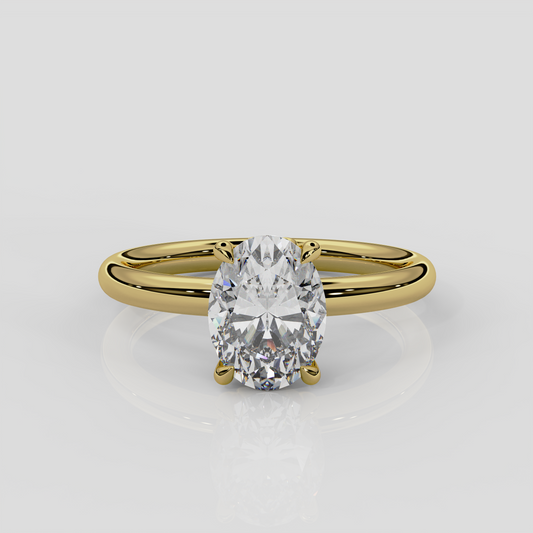 18ct yellow gold Daisy solitaire engagement ring by London jewellery designer, Georgina Yvonne. Nature inspired design with floral gallery and oval diamond centre 