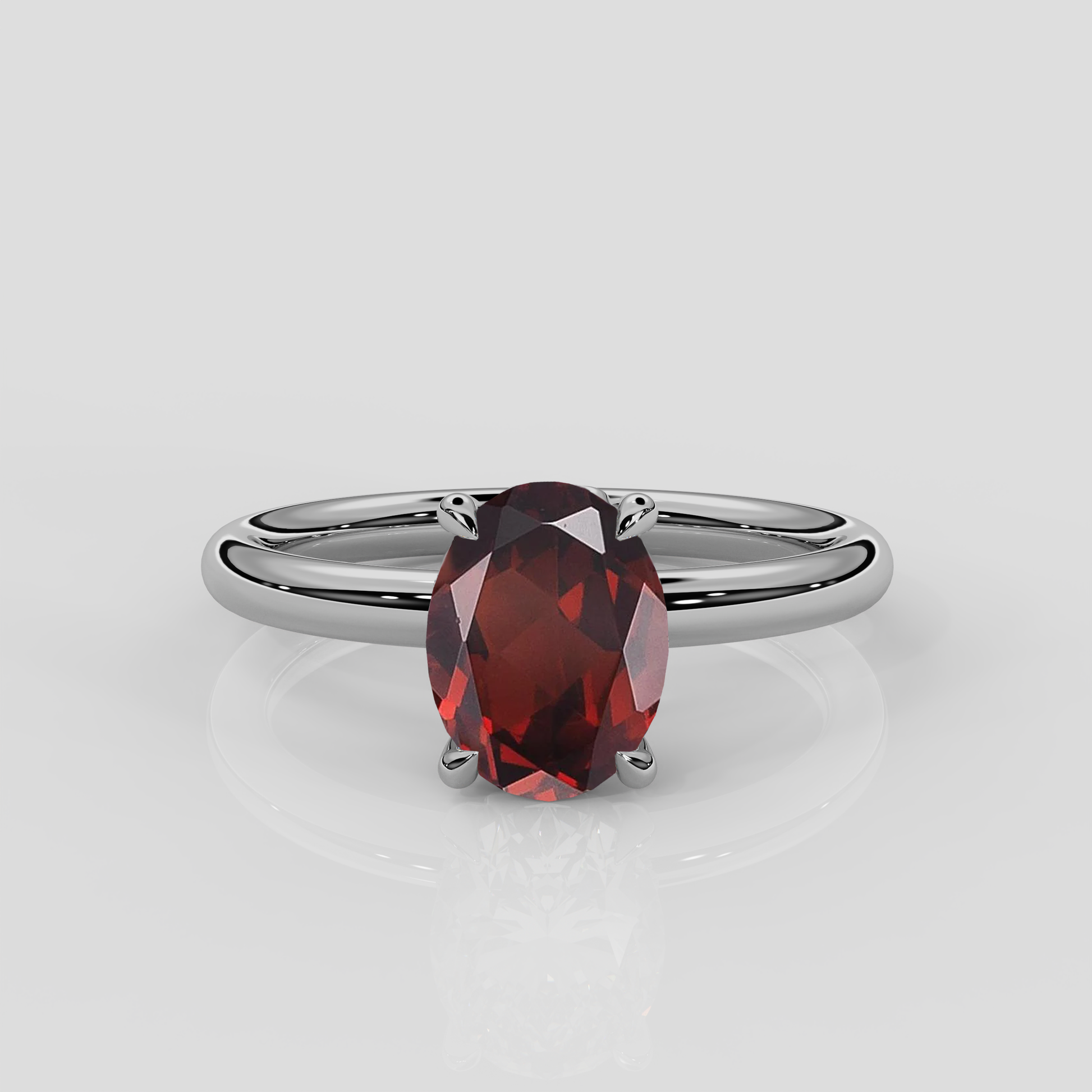 Platinum Daisy solitaire engagement ring with floral gallery and oval garnet centre stone by London jewellery designer, Georgina Yvonne. Nature inspired design