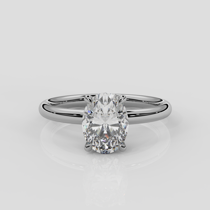 Platinum Daisy solitaire engagement ring by London jewellery designer, Georgina Yvonne. Nature inspired design with floral gallery and oval diamond centre stone