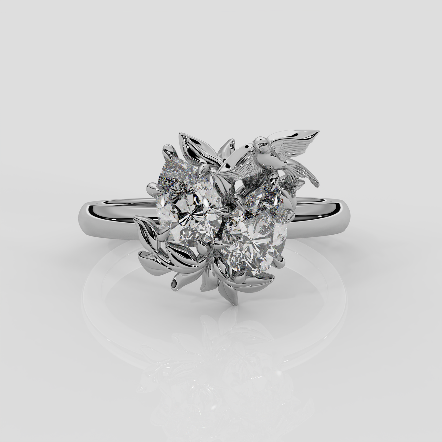 Platinum Enchanted Forest toi et moi enaggement ring by London jewellery designer Georgina Yvonne from her award winning jewellery collection, Wonderland. Two pear diamond centre stones 