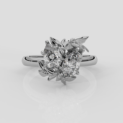 Platinum Enchanted Forest toi et moi enaggement ring by London jewellery designer Georgina Yvonne from her award winning jewellery collection, Wonderland. Two pear diamond centre stones 