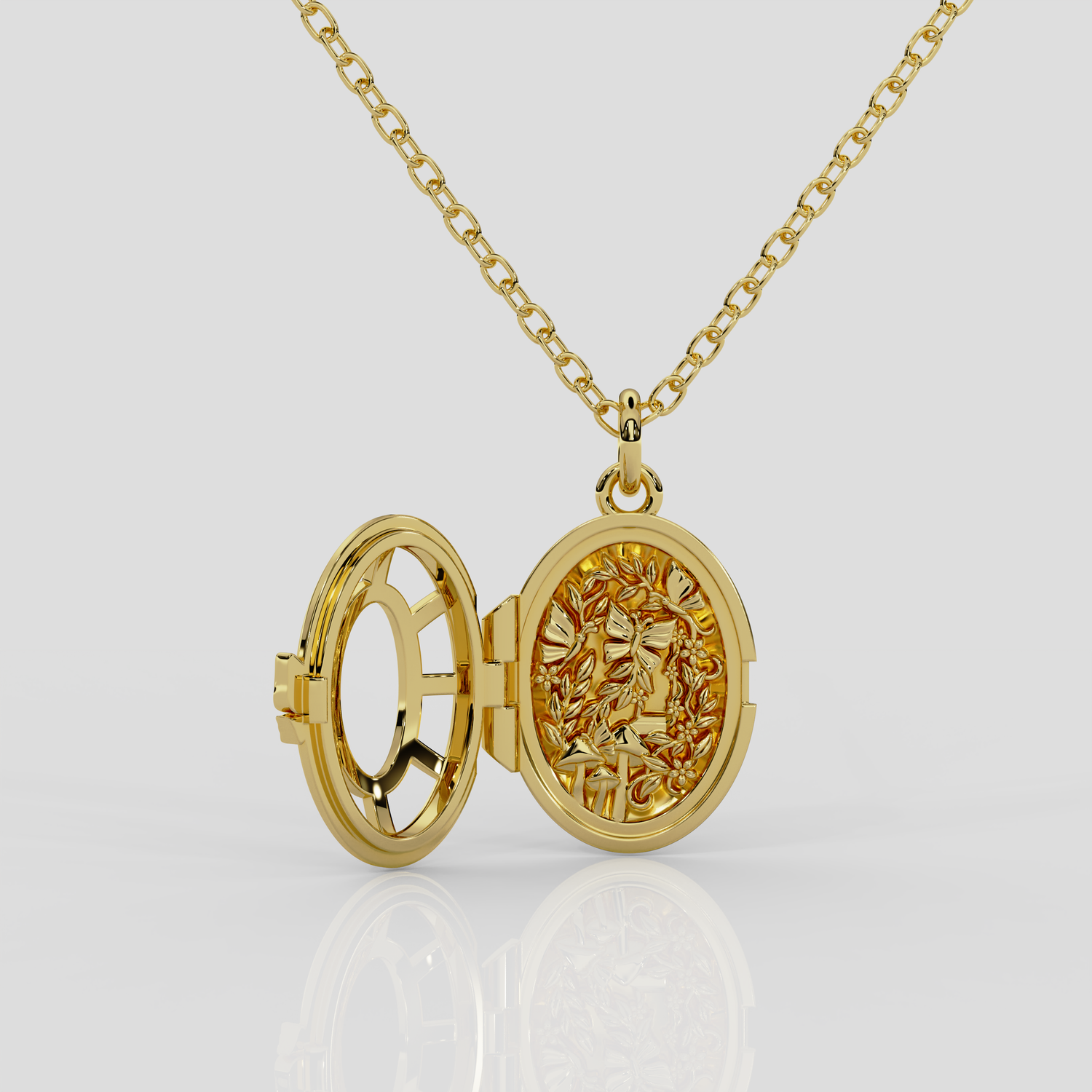 18ct yellow gold Fairytale locket from London jewellery designer, Georgina Yvonne's, award winning Wonderland jewellery collection. With fairytale inspired scene, featuring butterflies, mushrooms, and vines.