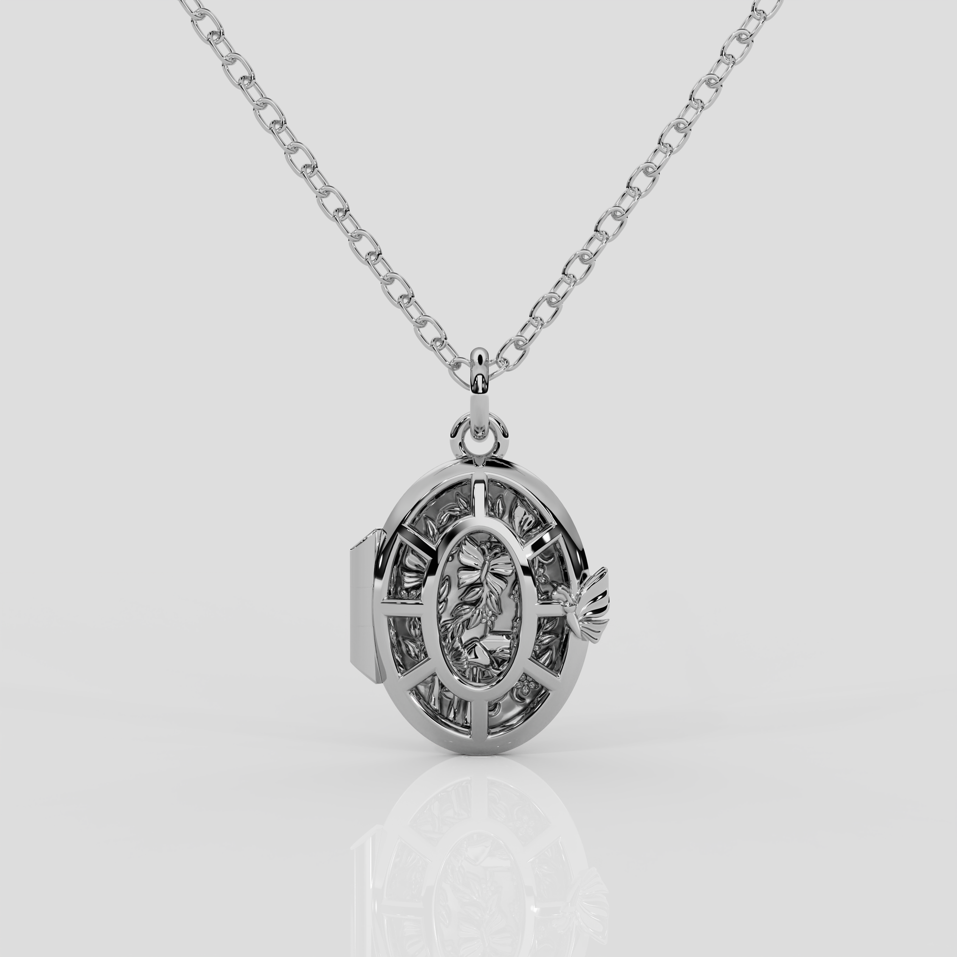 Platinum Fairytale Locket from London jewellery designer, Georgina Yvonne's, award winning Wonderland jewellery collection. With butterfly and enchanted forest scene. 